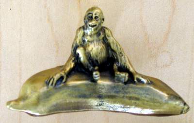 Orangutan on Banana knob brass finish